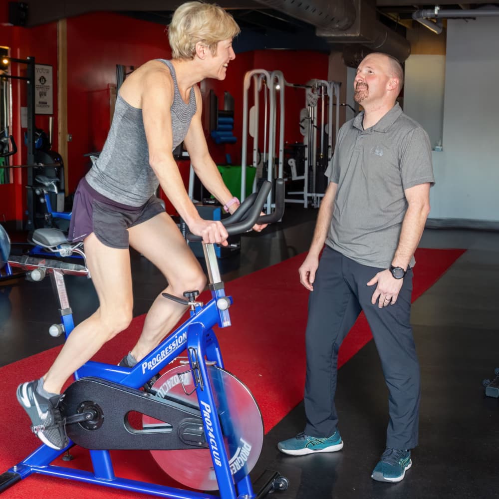 Woman works one on one with her personal trainer