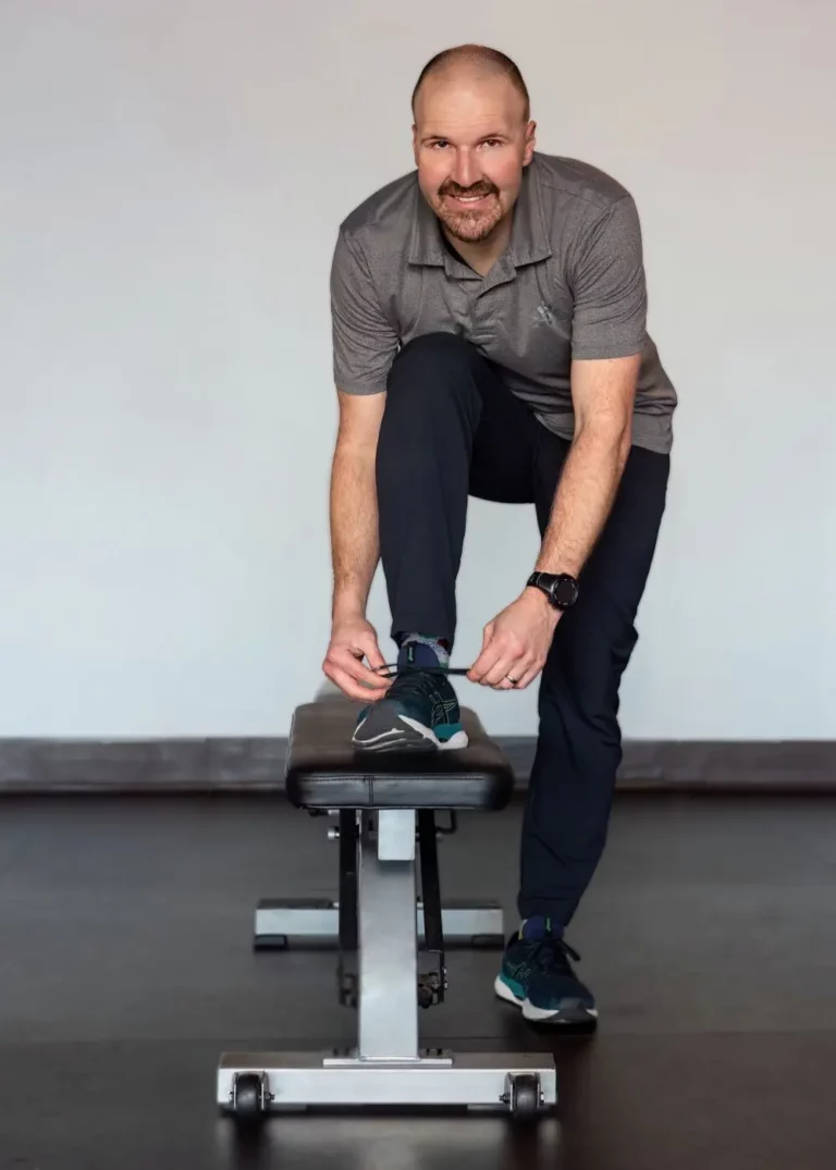 Kinesiologist Rob Appleton lacing up his shoes for a run